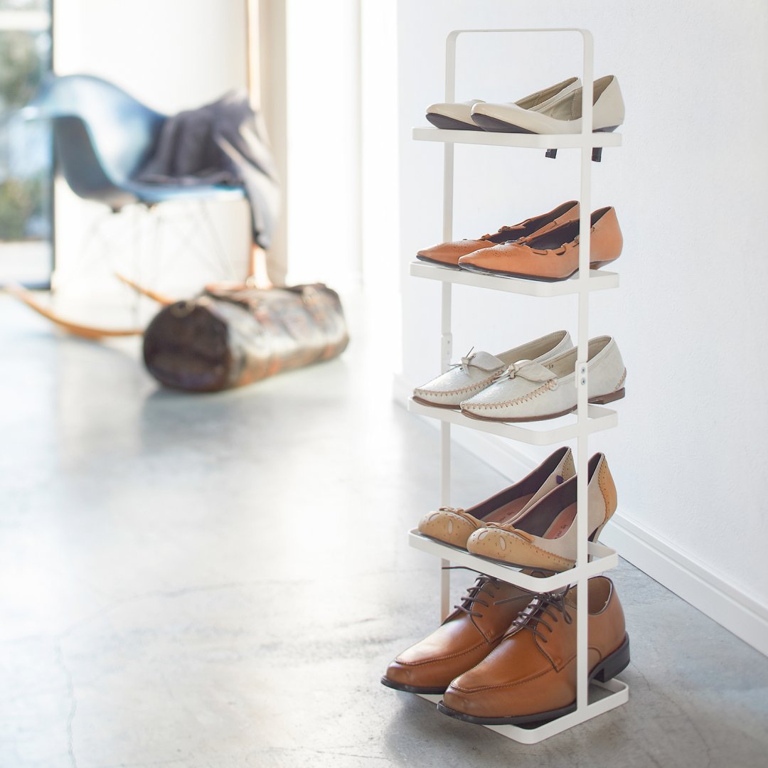 Tall shoe rack organizing five pairs of shoes