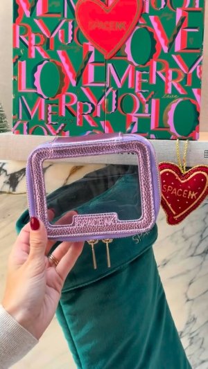 @spacenk’s instagram video of Space NK Large Travel Bag - Metallic Purple,Space NK Festive Hair Bow Clip,Space NK Joy Embellished Decoration