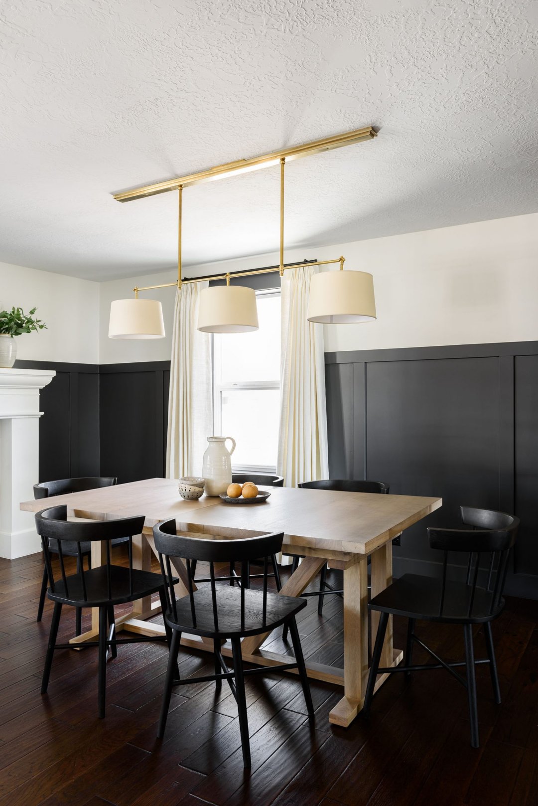 Light wood table with dark deals chairs