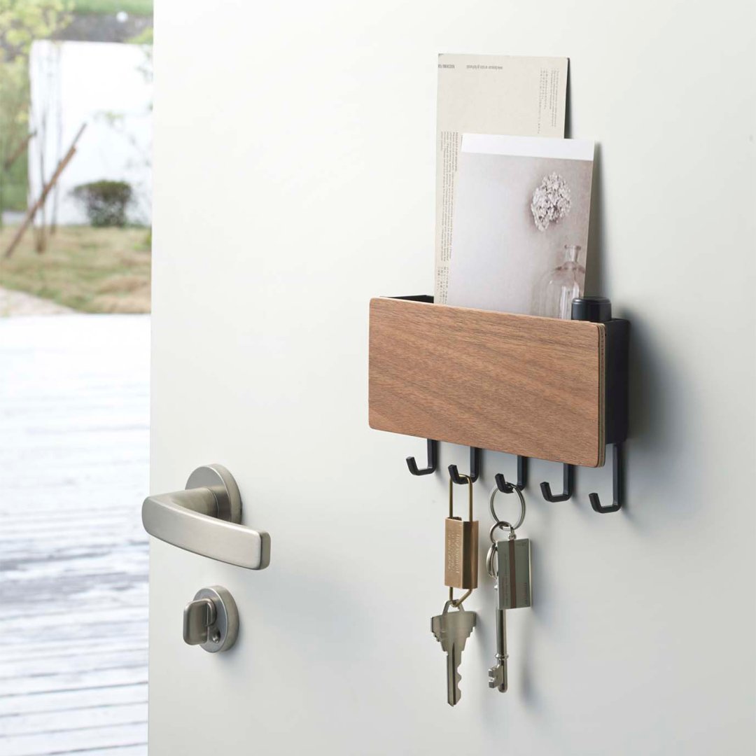 Want Magnetic Key Holder holding keys and items on closet door by Yamazaki Home.