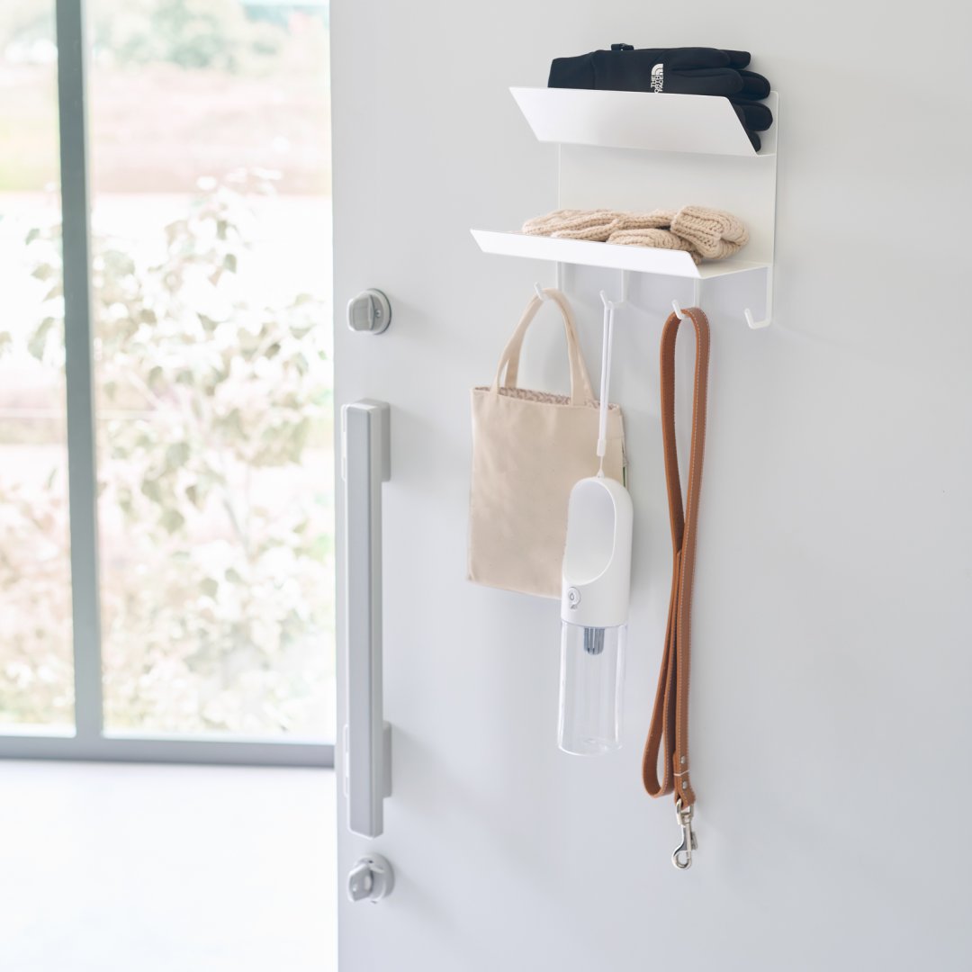 magnetic entryway rack holding a leash, tote bag, gloves and headband