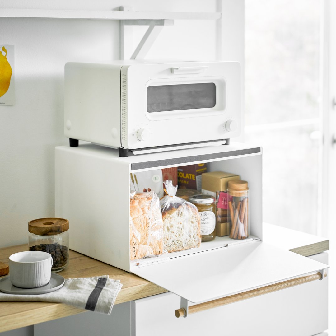 Yamazaki Home horizontal bread box with toaster oven on top styled in a modern kitchen