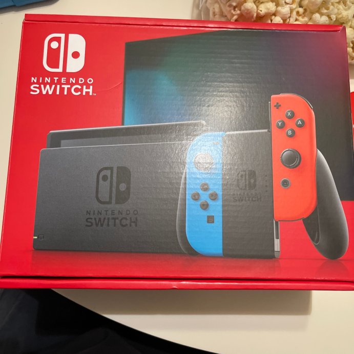 user image by Aubree, Nintendo Switch with Neon Blue and Neon Red Joy-Con