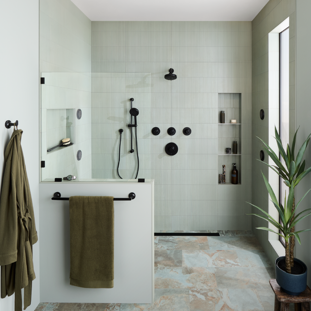 Healer bathroom with the Lentz Pressure Balance Shower System, FundamentALL Hand Shower, Shower Head, Body Sprays, Lentz Robe Hook, Towel Rod in matte black