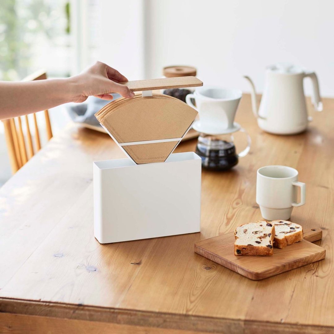 Coffee Filter Case by Yamazaki Home on a dining table.