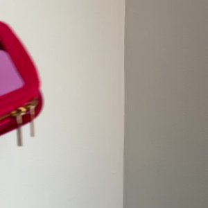 Mirali Makwana&rsquo;s mediaimport video of Space NK Mini Travel Bag Flamingo Pink