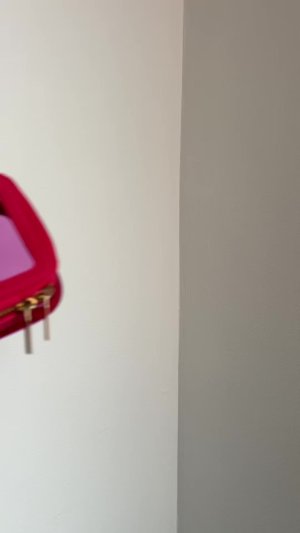 Mirali Makwana&rsquo;s mediaimport video of Space NK Mini Travel Bag Flamingo Pink