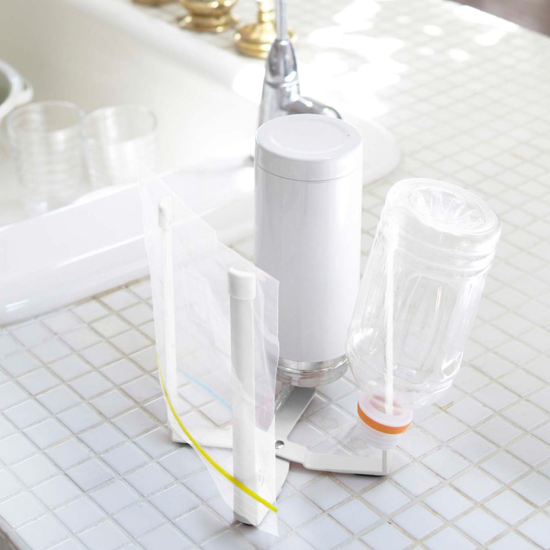 Yamazaki Home collapsible bottle dryer shown on kitchen counter