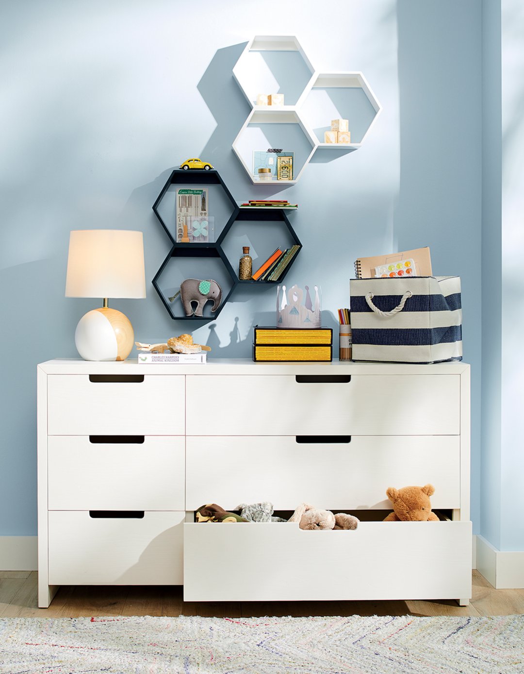 Shop Honeycomb White Hexagon Shelf, Honeycomb Blue Hexagon Shelf, White and Wood Table Lamp, Stripes Around Blue Cube Bin, Kids Abridged White Dresser and more