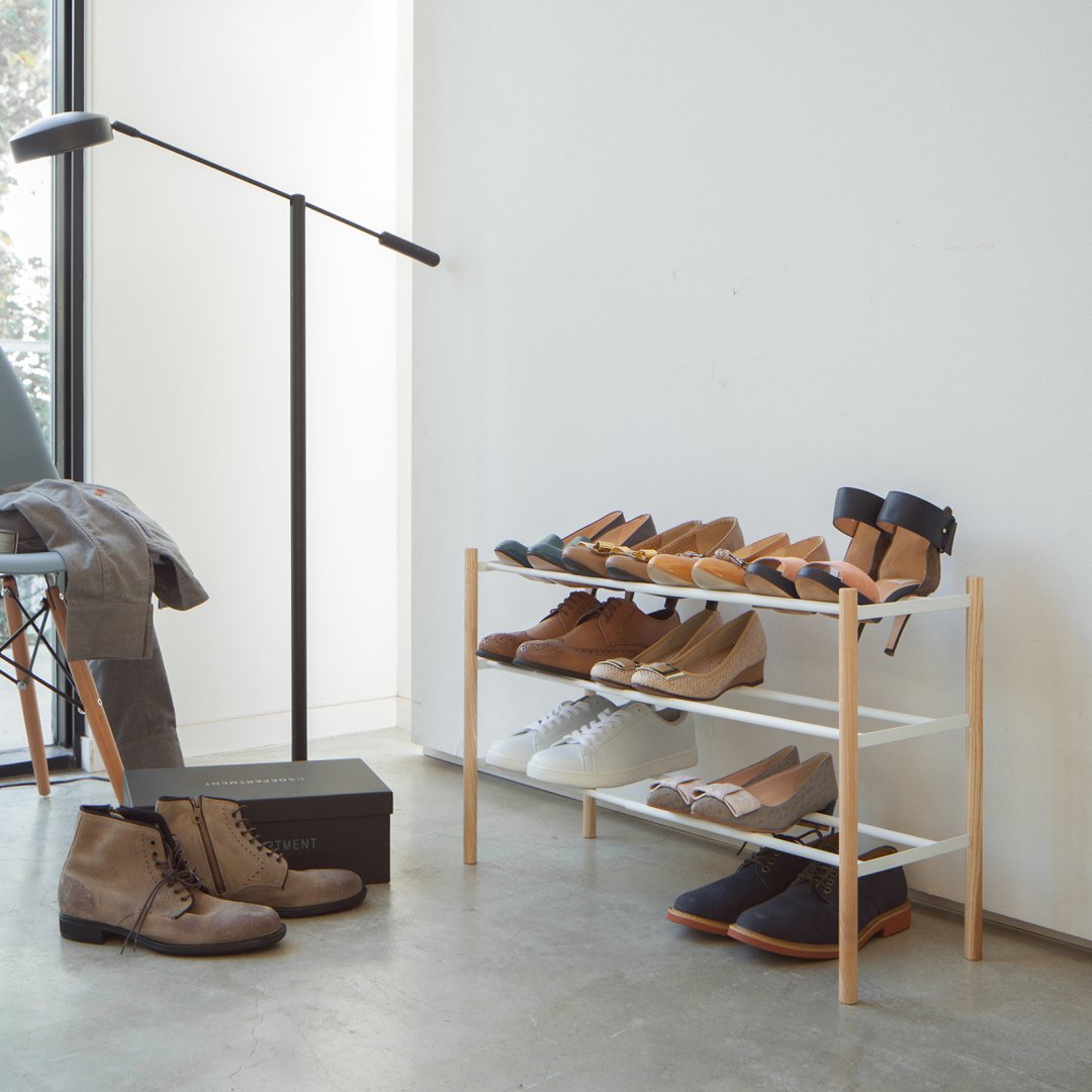 Expandable shoe rack organizing shoes in living room