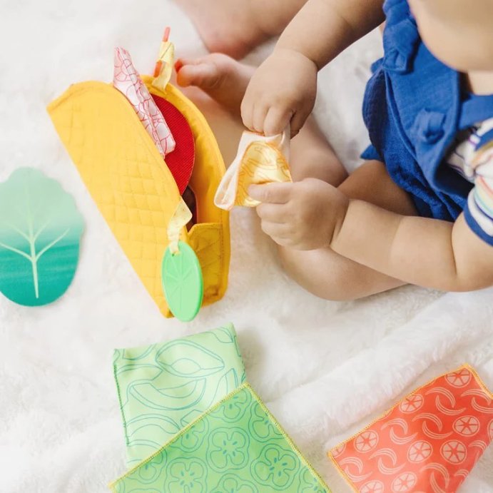 user image by @kidscornerkzn, Melissa &#38; Doug Multi-Sensory Soft Taco Fill &#38; Spill Infant Toy