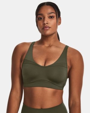 Woman adjusting her green coloured bra Stock Photo