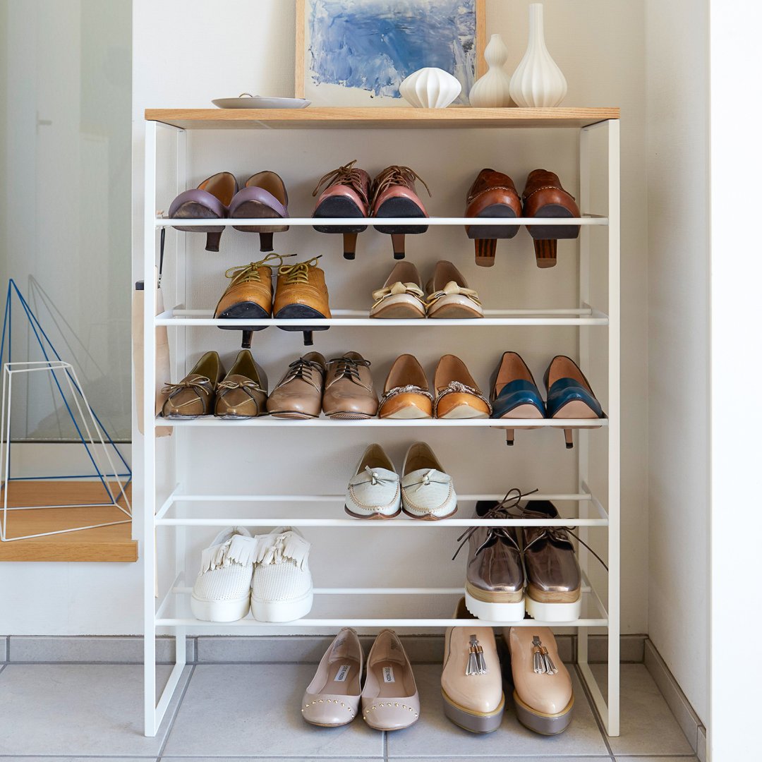 Six-Tier Shoe rack holding shoes in home entryway